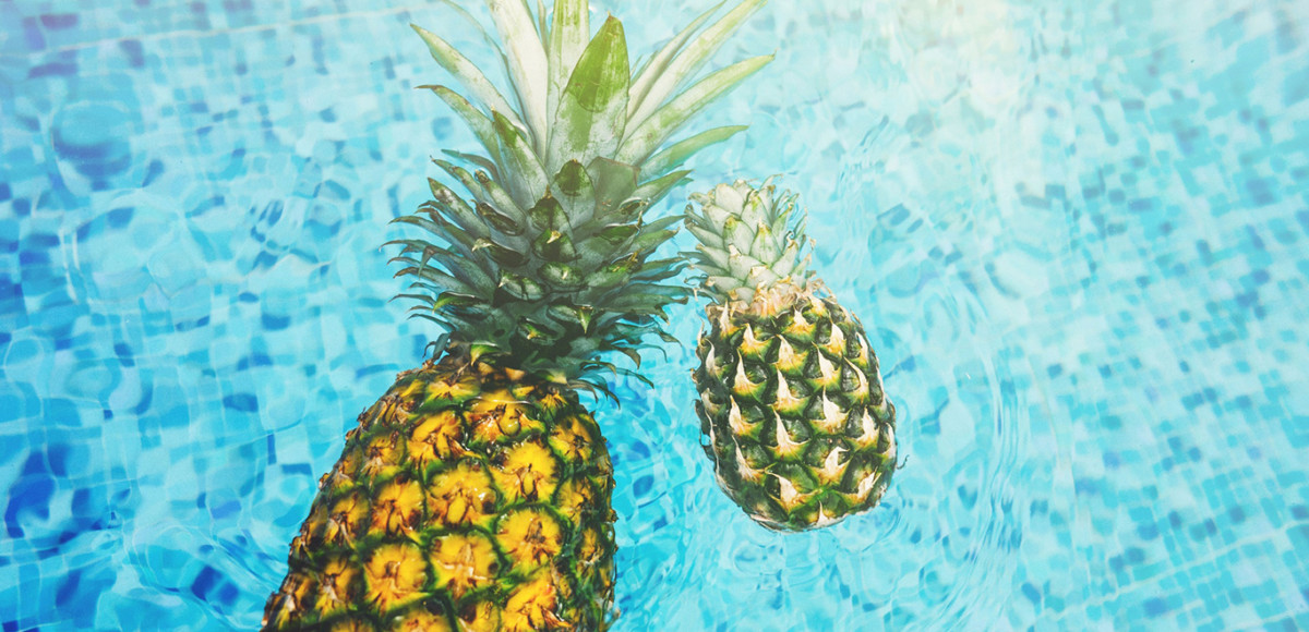 Pineapples in a blue pool