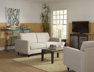 Inviting living room with cream sofas, wooden coffee table and entertainment center
