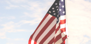 American flag against a blue sky background