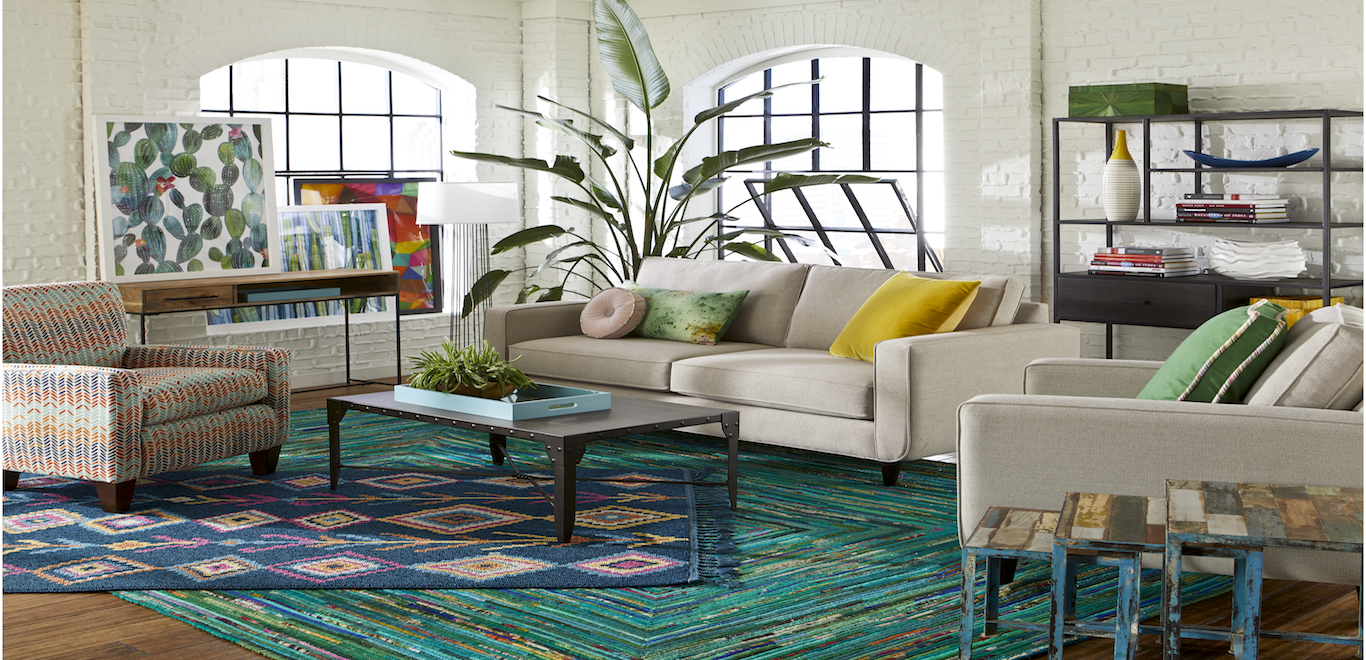 Sofa with bright pillows and rug
