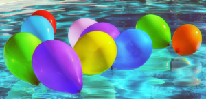 Colorful balloons in a swimming pool
