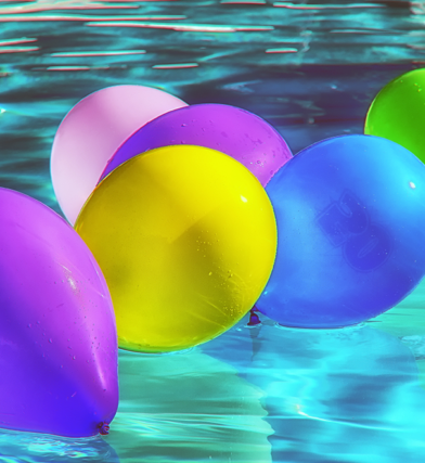 Colorful balloons in a swimming pool