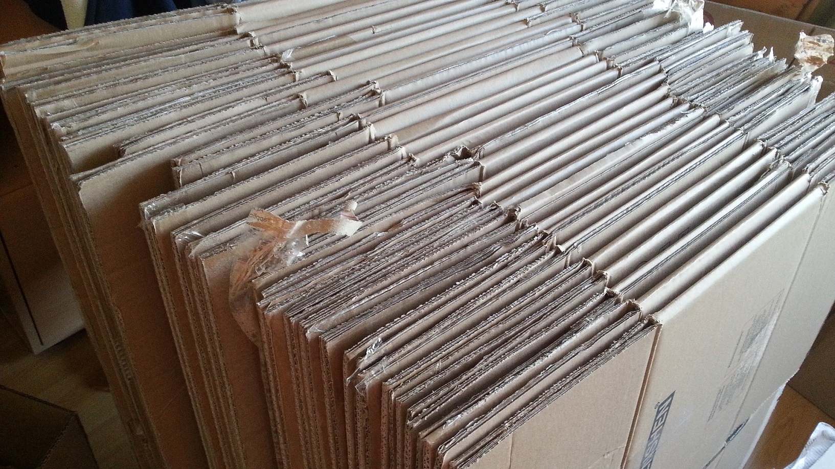 A large collection of flattened moving boxes