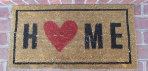 Cheerful welcome mat featuring the word "Home"
