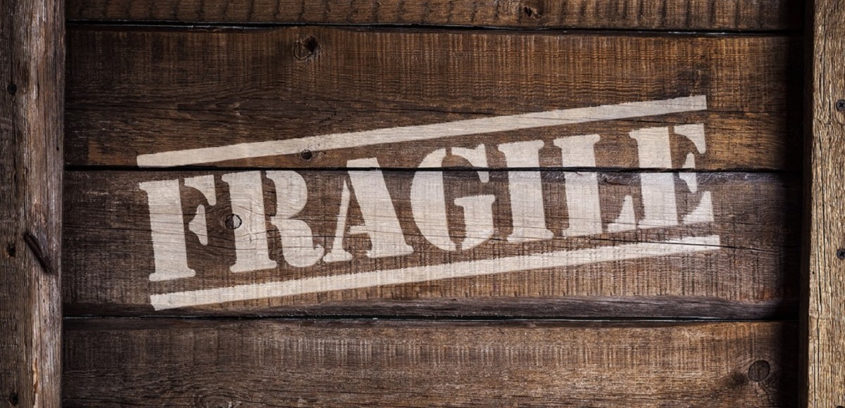 A wooden box marked with the word "FRAGILE"