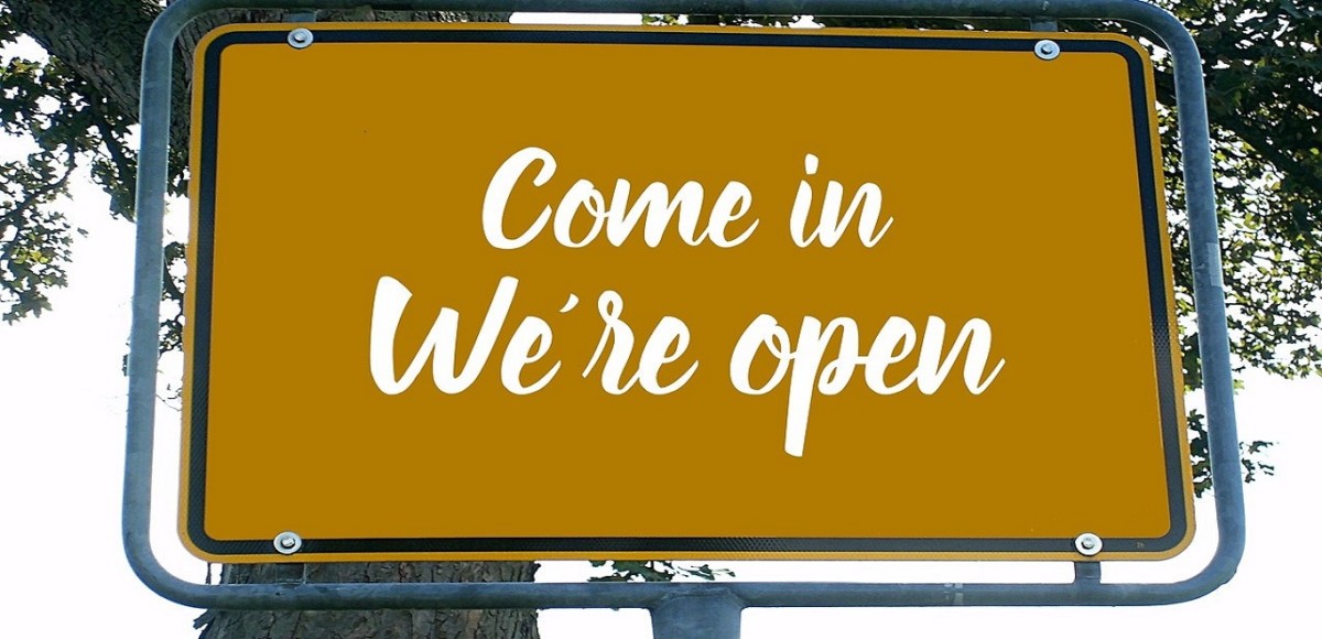 Large, yellow open for business sign