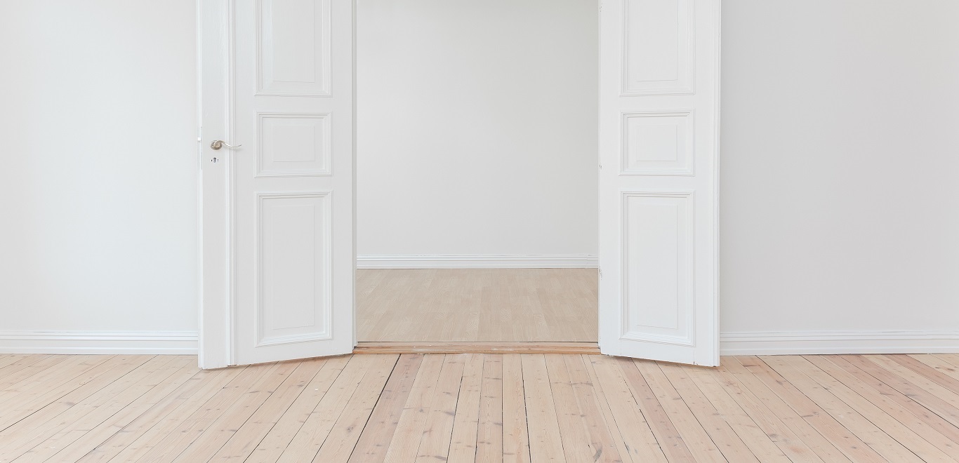 Empty rooms with wood flooring and white walls