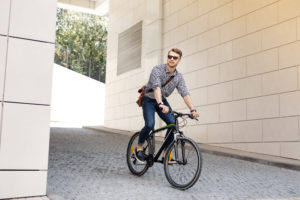 Man exploring a new city on his bike