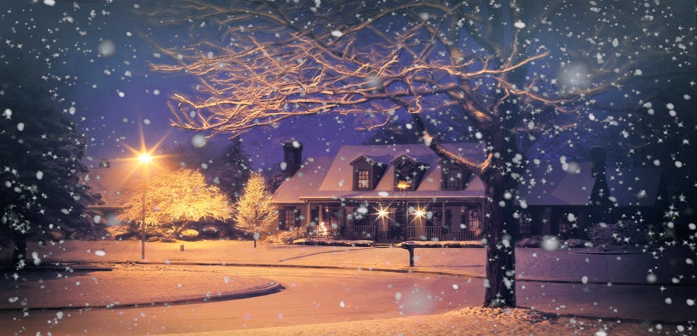 A cheerful looking home on a snowy winter's night