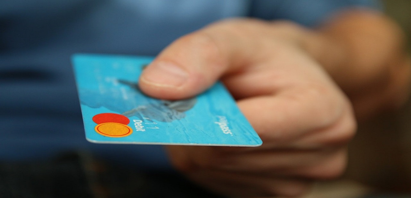 Man making a purchase with a debit card