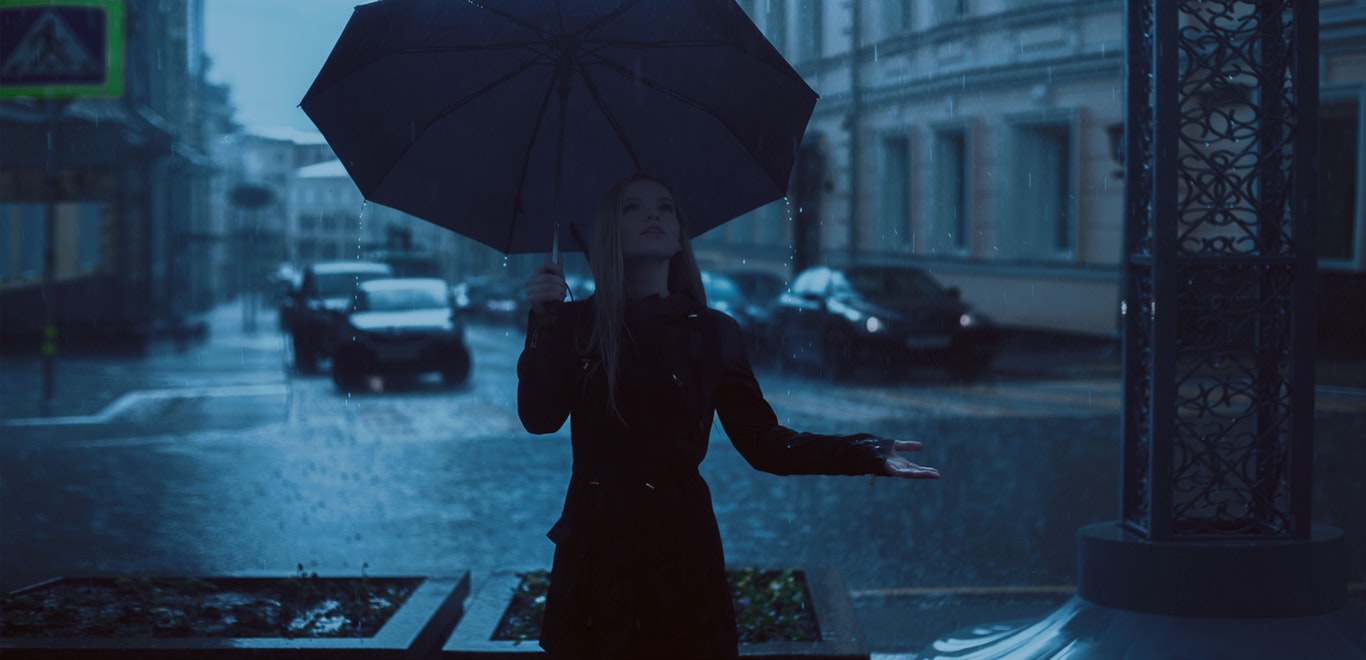 Woman in the rain with an umbrella