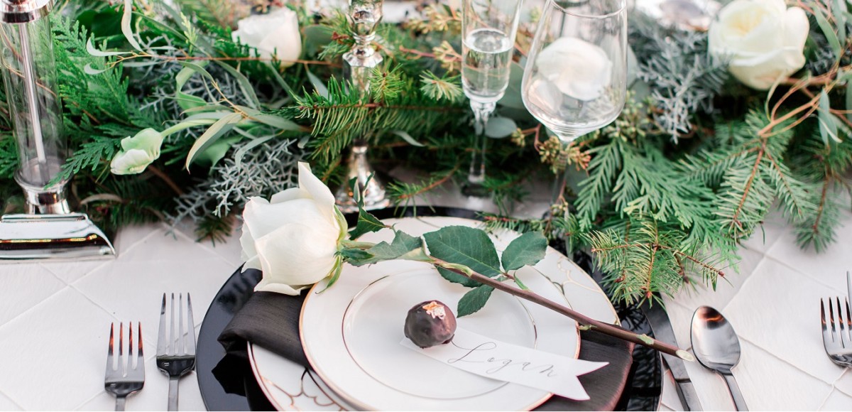 Winter table setting with white roses