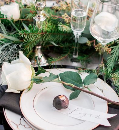 Winter table setting with white roses