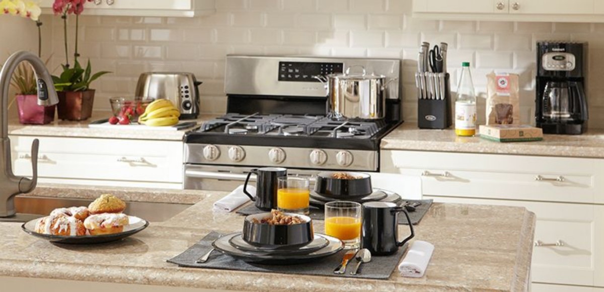 Kitchen counter with breakfast on a tray and stove in the background