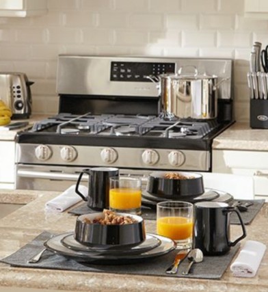 Kitchen counter with breakfast on a tray and stove in the background