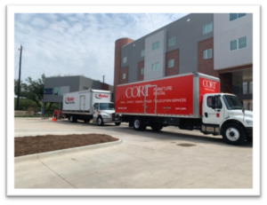 CORT Furniture Rental trucks at New Hope Housing