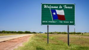 "welcome to Texas" sign along the highway