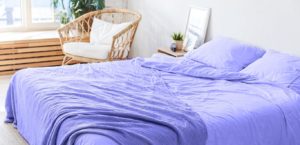Trendy bedroom incorporating 2022 interior design trends and pantone color of the year.
