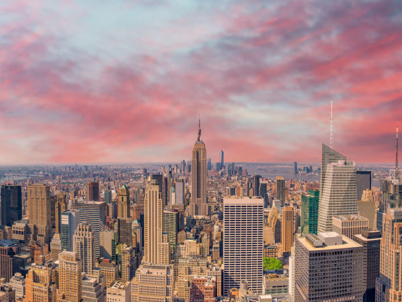 Living in manhattan New York City skyline at sunset.