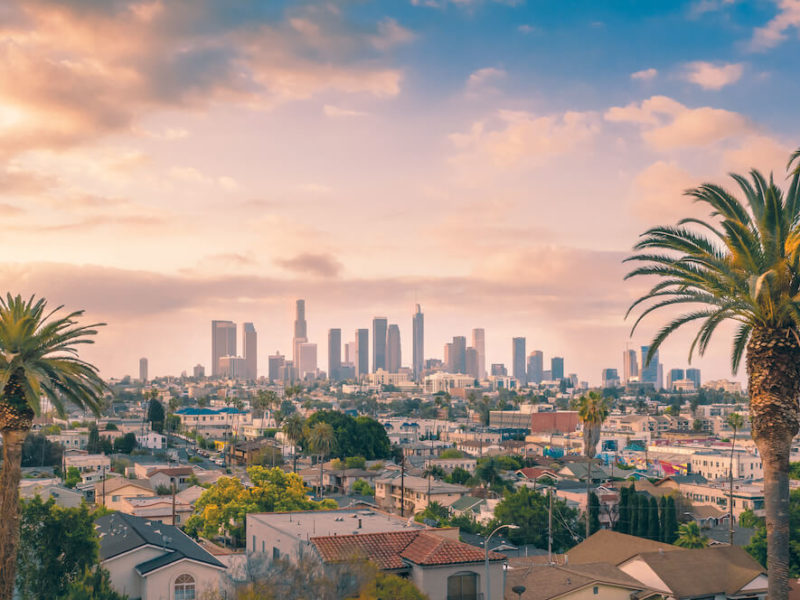 Skyline view of Los Angeles Downtown at sunset after moving to California.