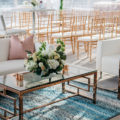 White sofas at outdoor wedding event