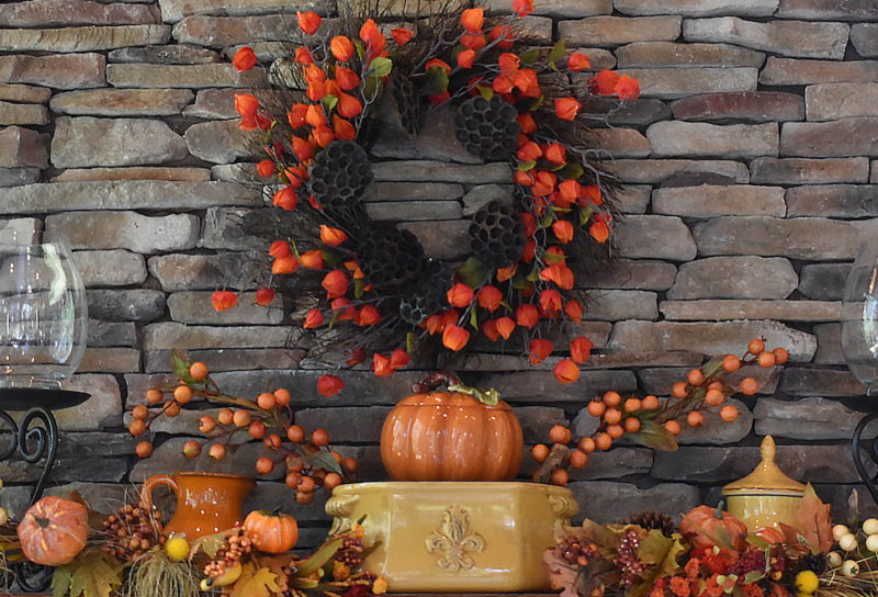 fall aesthetic at home with pumpkins, wreath, and natural elements to create mantle display
