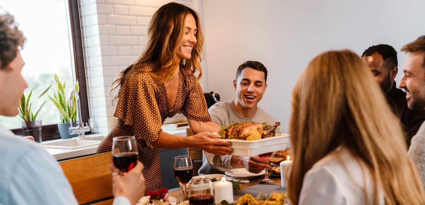 Friends gathering after determining how to host friendsgiving in your small apartment.