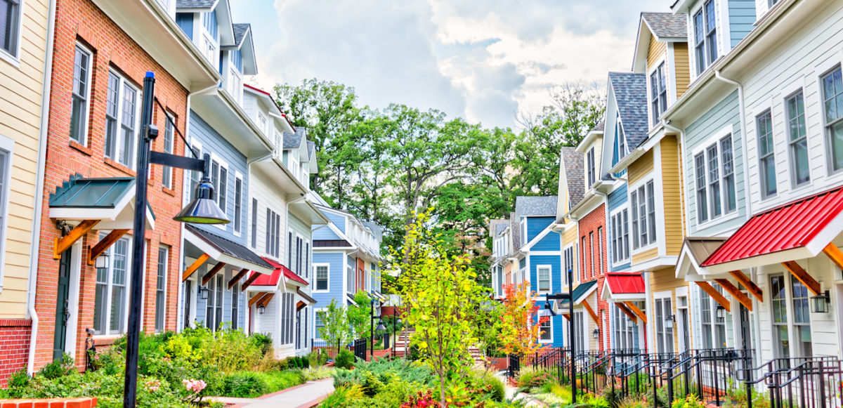row of colorful townhomes should you rent or buy a townhome