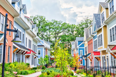 row of colorful townhomes should you rent or buy a townhome