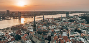 RIga rooftop view panorama at sunset with urban architectures and Daugava River. View of the old town