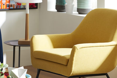Trinket Chair top rented furniture of 2022 most popular furniture of 2022 with yellow chair, modern lamp, and funky decor items