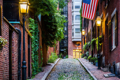 Cobblestone street lined with old brick buildings in Boston, Massachusetts.