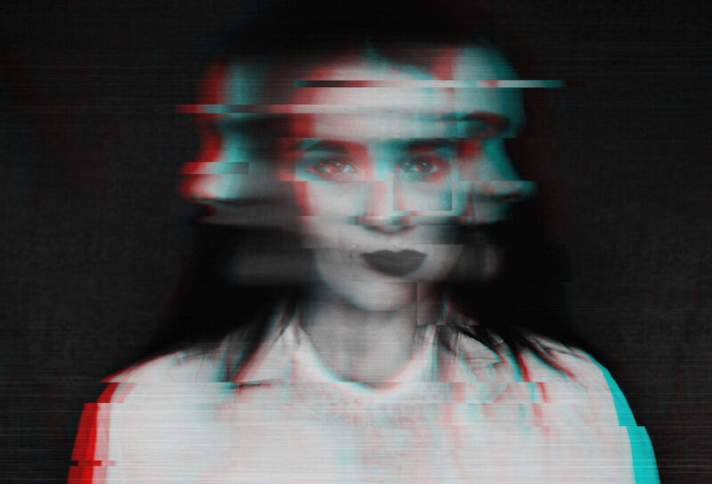 A surreal, glitchy, black-and-white photo of a woman.