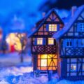 A miniature holiday village covered in snow.