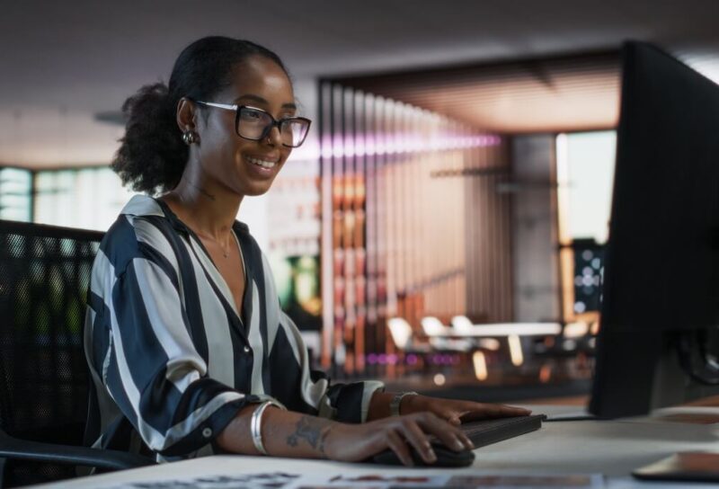 An engineer working at a computer in a modern office.