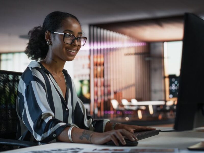 An engineer working at a computer in a modern office.