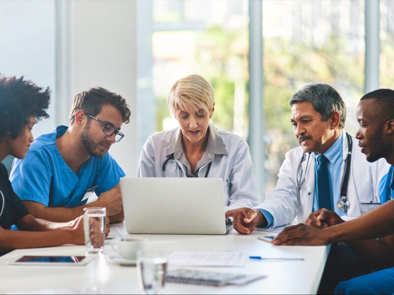 Flexible healthcare workspace with doctors around a table