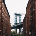 Dumbo, Brooklyn view of Manhattan Bridge with historic apartments—mirroring the story of renting furniture during a New York City home renovation.
