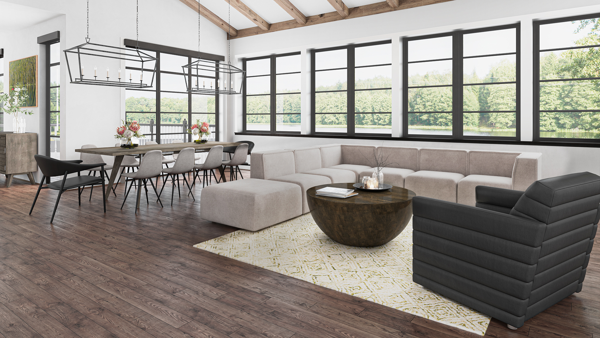 Stylish open-concept living and dining area with modern furniture rental from CORT, featuring the Marin sectional, black arm chair, lark cocktail table, and additional wooden accents